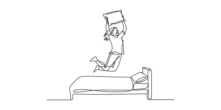 Man jumping on bed with pillow