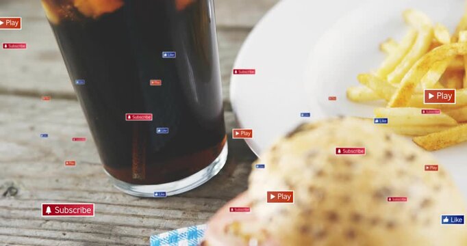 Overlay graphics floating, glass and burger shifting right, icons clustering, driving engagement