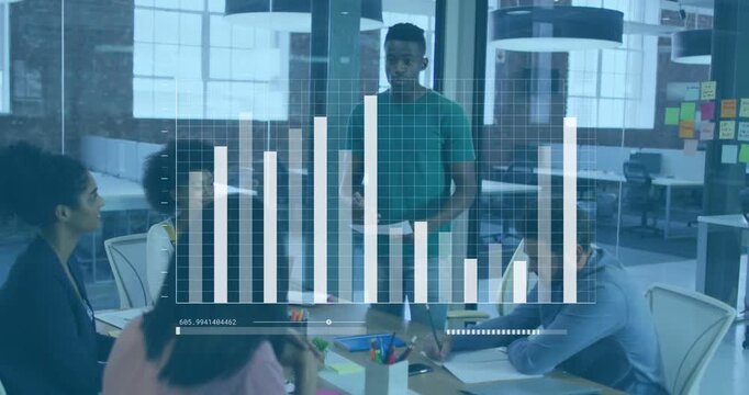 Gesturing presenter in short sleeves leading discussion at office table with updating bar-chart