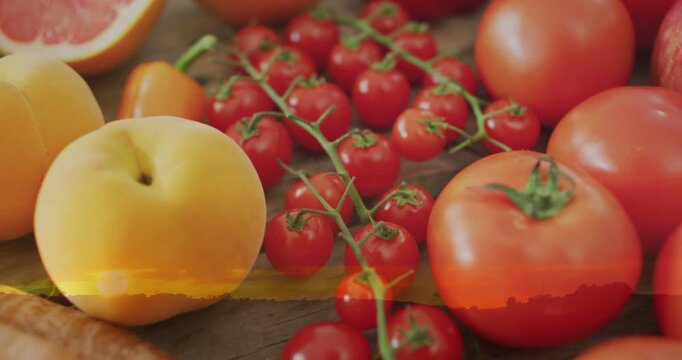 Camera panning back, revealing cherry tomatoes and food, warm light leak showcasing layout