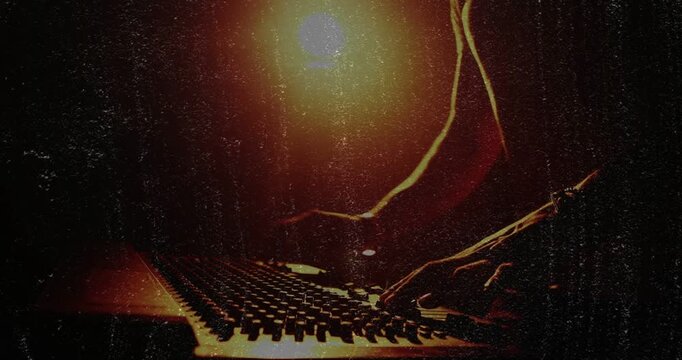 Male musician leaning in and manipulating faders, knobs, pads while shaping live electronic mix