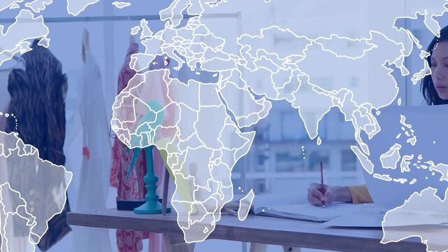 Writing designer sketching at worktable, wearing yellow top, measuring tape, red pencil, copy space