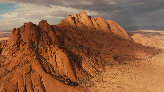 Drone shot over Spitzkoppe in Namibia desert sunset cinematic