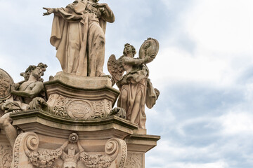 Fototapeta premium Part of the Statue of St Francis Borgia on Charles Bridge in Prague old city in Czech Republic