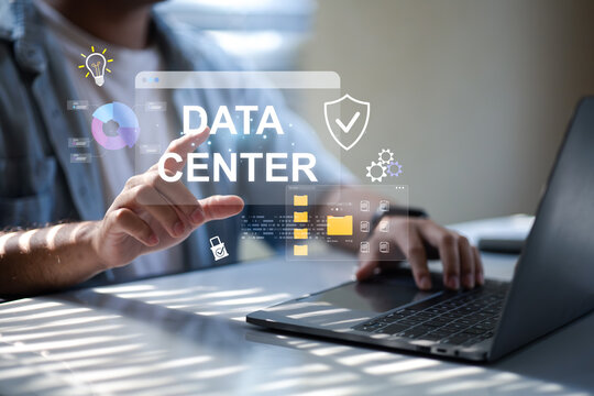 Data center programmers are using laptops at their desks, accessing data center data to customize electronics or perform company work by accessing large data sources.