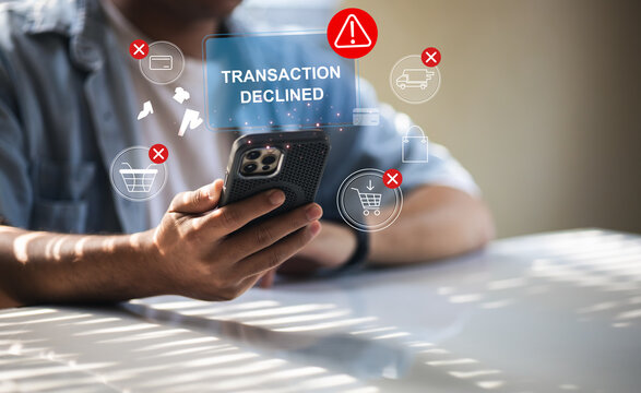 A smartphone displaying a red payment error message, indicating that the transaction was rejected, and the inconvenience of services online , insufficient funds, and technical bank errors.