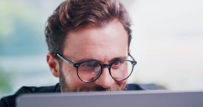 Glasses, laptop and smile of web developer man in office for programming, review or system update. Computer, design and development with programmer person in workplace for application framework