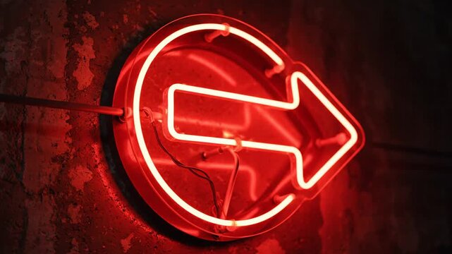 Bright red neon arrow sign pointing right on dark textured wall