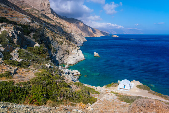 White chapel above a turquoise cove in Amorgos