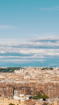 Sweeping panoramic view from the Gianicolo hill showcasing the historic skyline of Rome, Italy, with its famous domes and ancient buildings under a partly cloudy sky on a sunny day