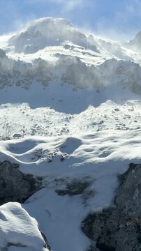 Winter's texture on the mountain peaks, misty and mystical landscapes of windswept summits.