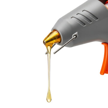 A hot glue gun with melted glue dripping from the nozzle on transparent background