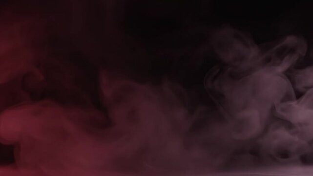Cinematic Abstract Smoke with red and white vapor clouds rising against a dark black background for title sequences and creative video backgrounds.
