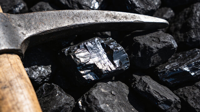 Pickaxe on coal rocks mining tool.