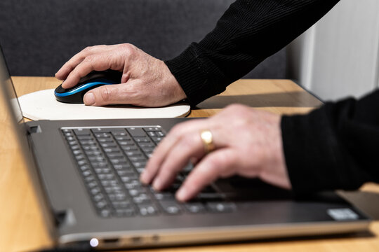 using keyboard and mouse on a computer focus on right hand