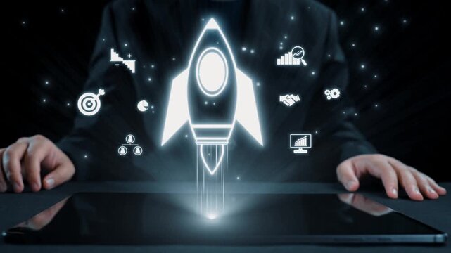 A business professional hands hover over a tablet displaying a stylized rocket and digital icons symbolizing growth, innovation, and success in a dark environment. Qubit