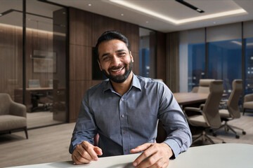 Happy indian business man, teacher talking to web cam on conference video call. Smiling businessman...