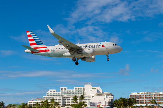 American Airlines Airbus 319 N9006 flying over Maho Beach before landing on Princess Juliana International Airport SXM on Sint Maarten, Dutch Caribbean. 