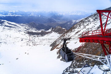 Gipfelwelt 3000 peak sky gondola and Alps landscape view. © xbrchx