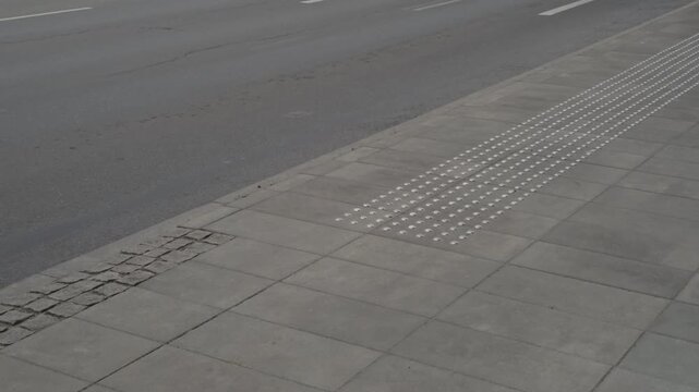 Tranquil city sidewalk highlighting userfriendly design and smooth incline
