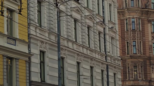 Photograph showcasing detailed masonry and architectural ornamentation in city environment