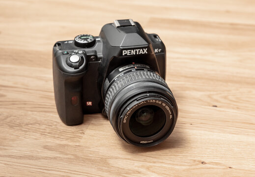 Gothenburg, Sweden - May 04 2019: Digital single lens reflex camera front view on floor.