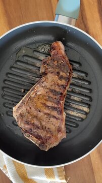 Cooking a New York Sirloin Steak to a Hot Pan