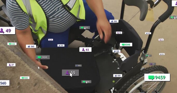Animation of social media icons foating against mid section of worker assembling a wheelchair