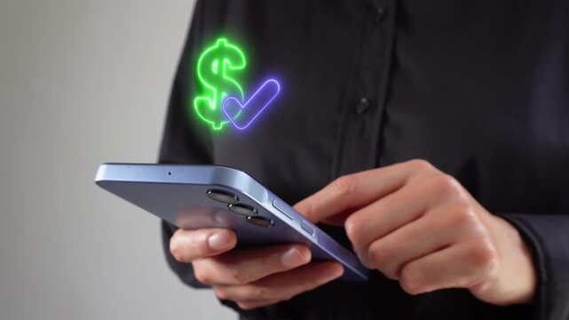 Hand holds smartphone, glowing dollar sign and check mark float above screen. User appears focused, suggesting financial success or approval. Ideal for business, finance, or mobile payments contexts