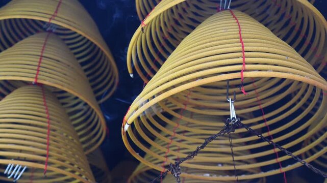 Burning incense spirals hanging in Che Kung temple, hong kong.