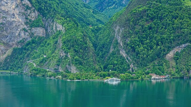 Time lapse, a small lakeside hamlet on the southern shore of Lake Lucerne. Ferry landing, marina and scenic views across the lake. Isleten, canton Uri, Switzerland.