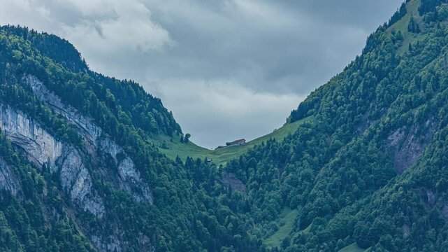 Time lapse, view on a Swiss Alpine farm house high in the mountains. Isenthal, canton Uri, Switzerland.