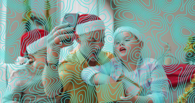 Animation of shapes over caucasian father and sons at christmas