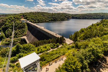 Fototapeta premium BODE, GERMANY - JUNE 28, 2022: Tourists at suspension bridge Titan RT at Rappbode dam, Saxony-Anhalt state, Germany