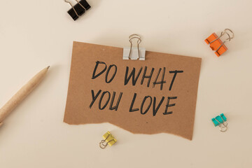 Love What You Do, Do What You Love, motivational quotes on colorful sticky © Uladzislau