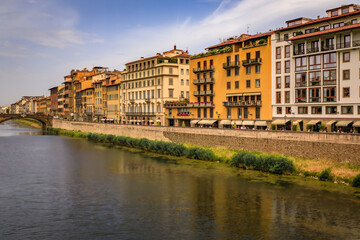 Fototapeta premium Cityscape with medieval gothic buildings near the famous bridge of Ponte Vecchio on the river Arno River in Centro Storico, Florence, Italy