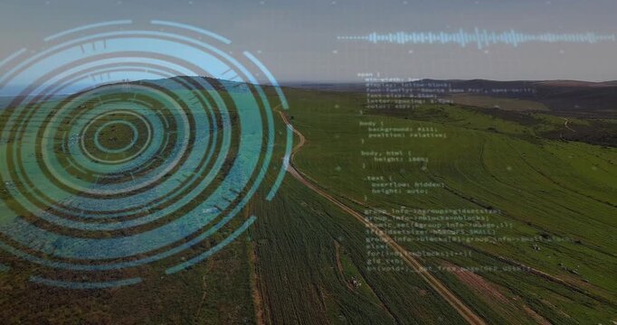 Turquoise concentric interface hovering over fields, showing dirt road, floating code, waveform