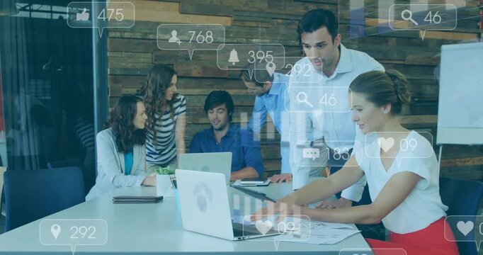 Marketing team tapping tablet on report around table, causing animated metrics growth