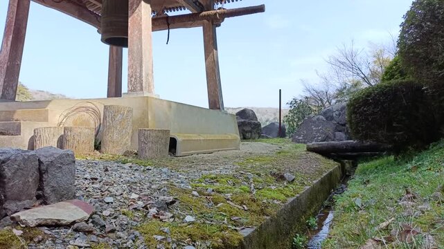 Traditional Japanese Temple Bell at Buddhist Temple in Quiet Outdoor Setting