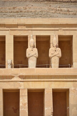 Fototapeta premium Osirian column in the mortuary temple of Hatshepsut located opposite the city of Luxor, Egypt