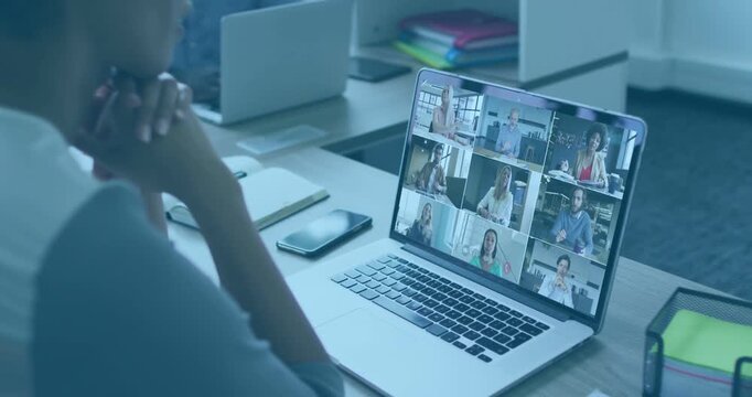 Woman joining business call after join, watching 3x3 laptop grid while wireframes crossing laptop