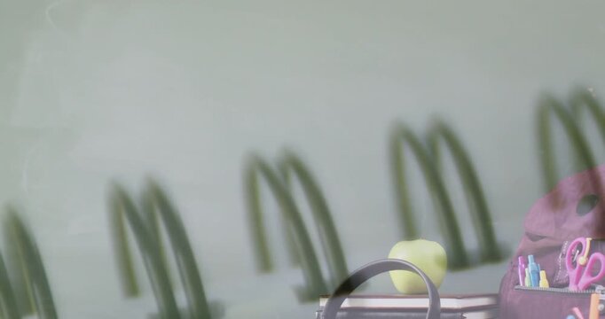Colorful foreground moving right revealing study desk with headset, books, yellow ball, pencil case