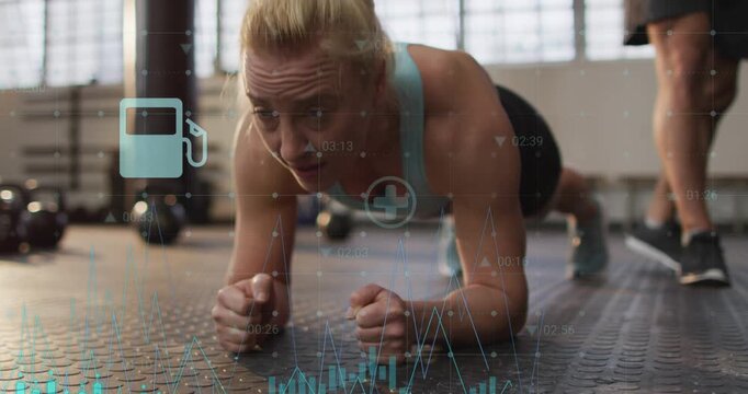Holding forearm plank woman in blue top at gym as teal overlays appearing, kettlebells, monitoring
