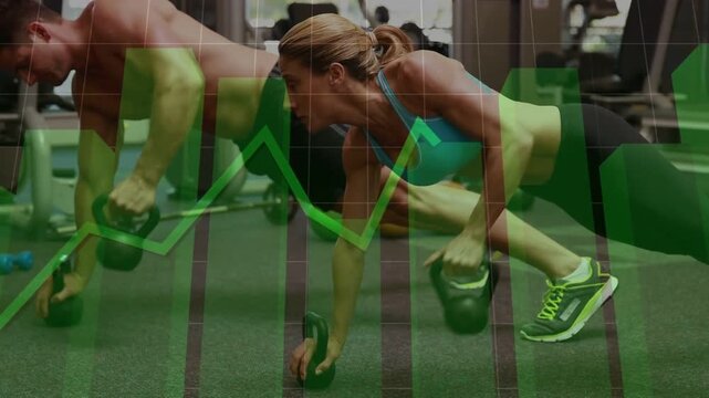 Vertical video: Starting plank, woman teal bra, shirtless man on turf doing KB rows for core power