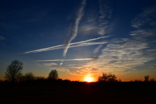 Contrails and Clouds in a Sunset
