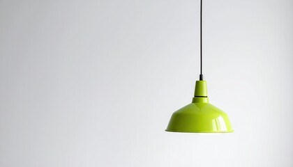 Obraz premium A Bright Lime Green Pendant Lamp Hangs Suspended Against a Clean White Background Emphasizing its Industrial Design and Vivid Color