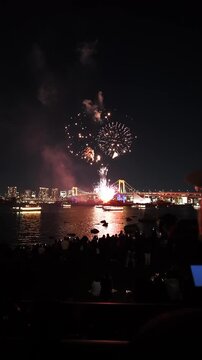 Fireworks over Odaiba Tokyo with city skyline at night