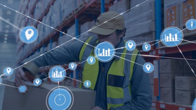 Animation of network of connections with icons over caucasian male worker with cartons in warehouse