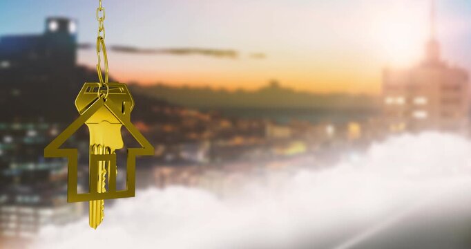 Animation of golden house model and key over aerial view of defocused cityscape at sunset