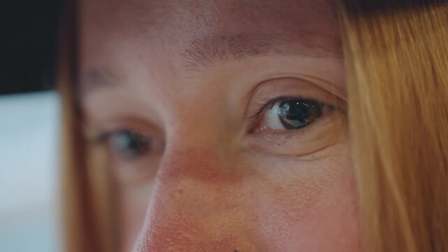 Closeup white woman glancing away inside car, tense guilt and adrenaline, freckles and hat brim, teary eyes and shifting focus, cinematic shallow depth, implied snatcher or suspect, internal conflict
